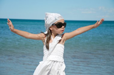 Little girl on the beach clipart