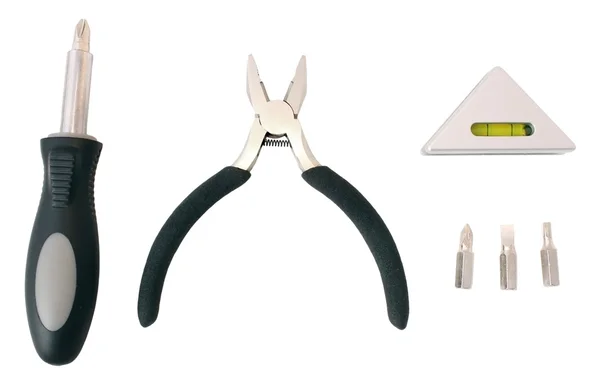 Tre utensili (cacciavite, pinze, livella) e punte — Foto Stock