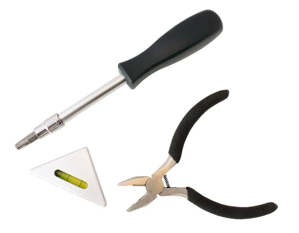 Three tools: screw-driver, pliers and level — Stock Photo, Image
