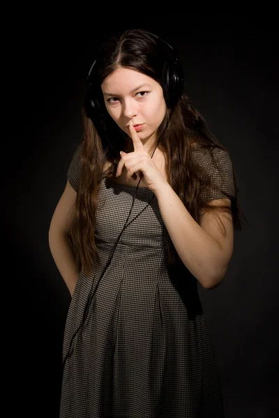 Girl in headphones listening music — Stock Photo, Image