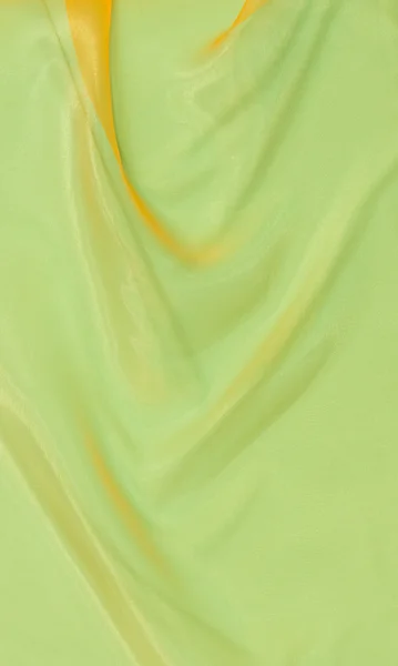 Зеленый атласный фон — стоковое фото