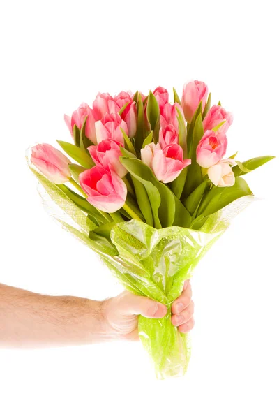 Ręka trzyma kwiaty — Zdjęcie stockowe