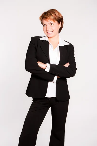 Beautiful businesswoman with her arms crossed — Stock Photo, Image