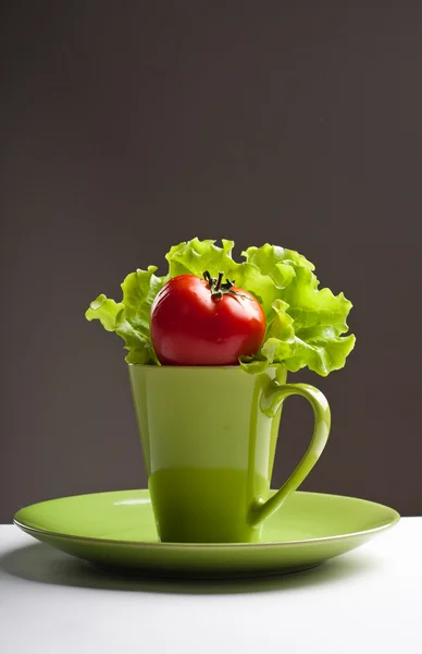 Stock image Tomato and lettuce in a mug