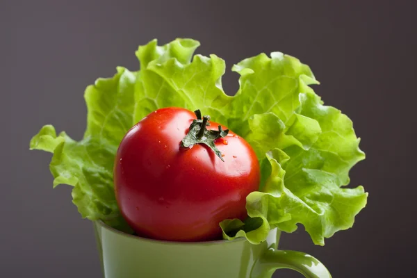 stock image Tomato and lettuce in a mug