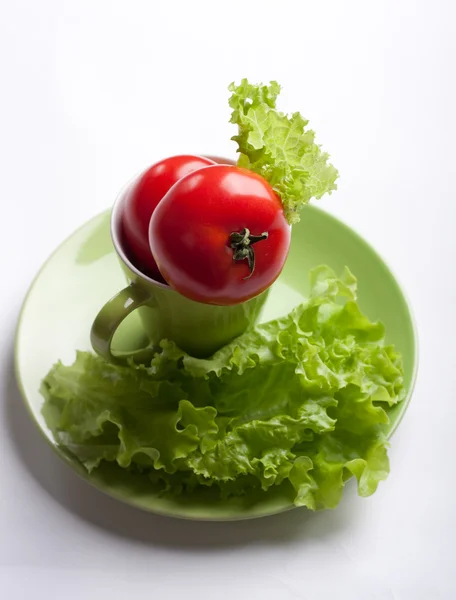 stock image Tomato and lettuce in a mug