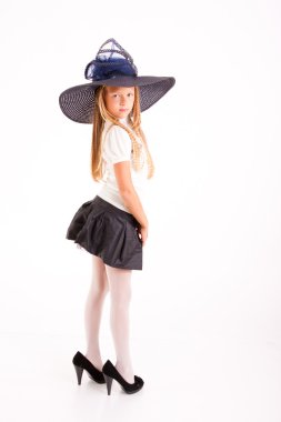 Funny girl in big hat and mum's shoes, isolated on white clipart