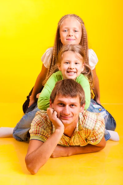Happy Dad Two Daughters Yellow Background — Stock Photo, Image