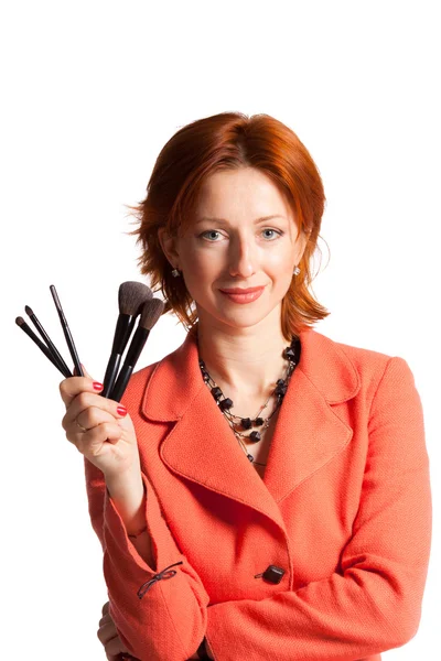 Woman with brushes for a make-up in hands — Stock Photo, Image