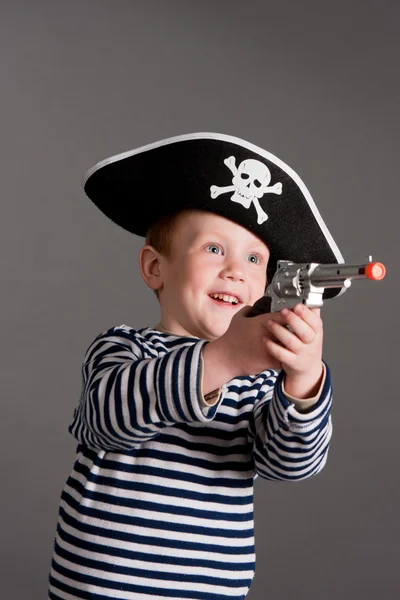 海賊のスーツで陽気な小さな男の子 ストック画像