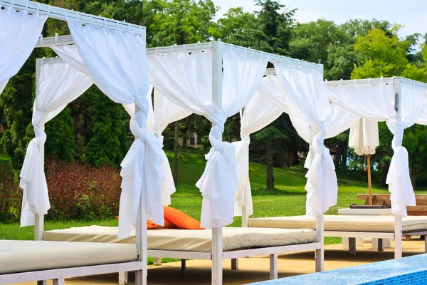 stock image Deck-chairs with a baldachin in summer on nature, resort in Bulgaria