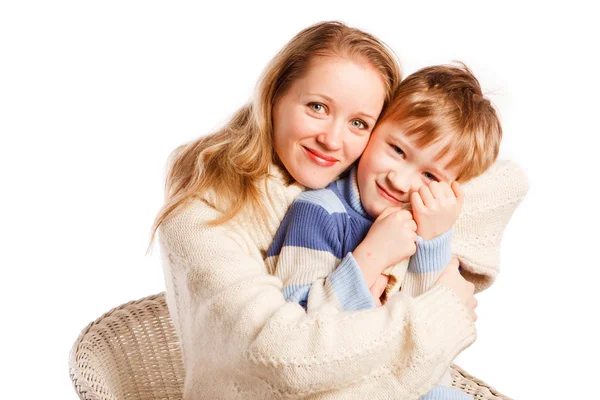 Mulher com um filho em um fundo branco — Fotografia de Stock