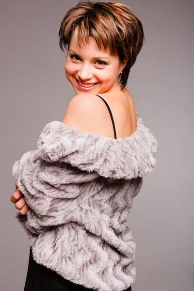 Woman is in the fur coat of grey color — Stock Photo, Image