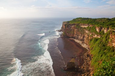 Rocky beach on Bali clipart