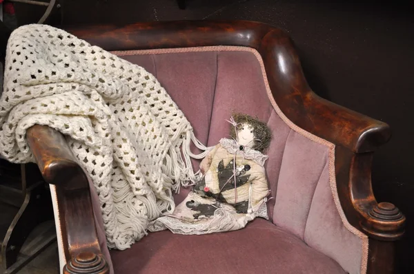 Doll on antique chair — Zdjęcie stockowe