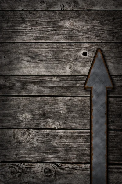 Freccia arrugginita su sfondo di legno — Foto Stock