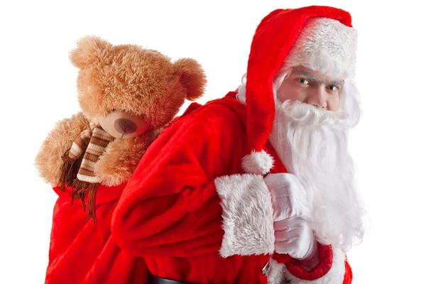 Retrato de meio comprimento de Papai Noel com um saco de presentes — Fotografia de Stock