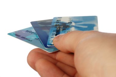 Credit cards in a hand of the man clipart