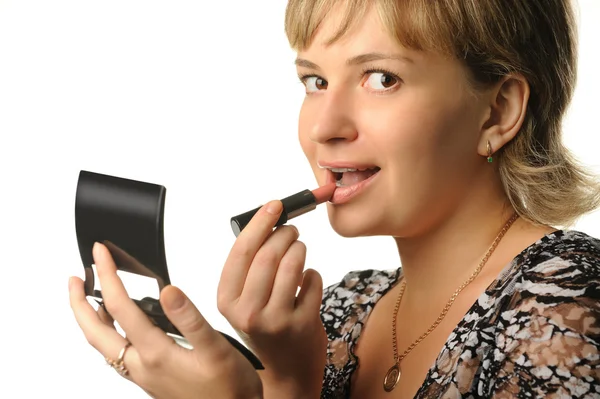A jovem faz uma maquiagem — Fotografia de Stock