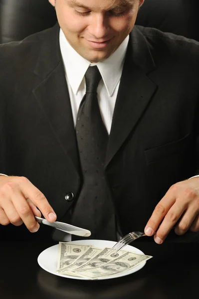 El hombre de negocios cenando dólares —  Fotos de Stock