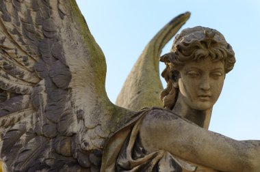 Monument to an angel on a cemetery clipart