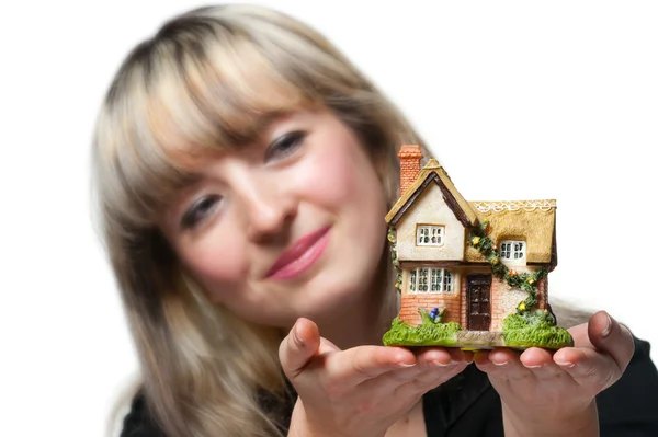 The business woman holds the small house in the hands — Stock Photo, Image