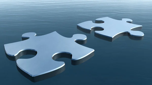 Dois quebra-cabeças em uma superfície de água — Fotografia de Stock