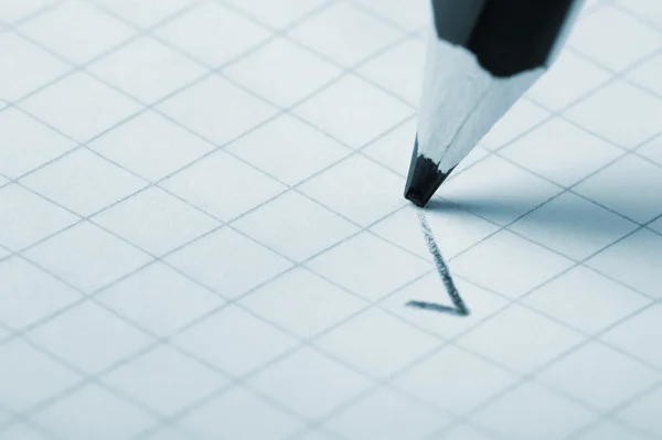 Pencil writing a mark — Stock Photo, Image