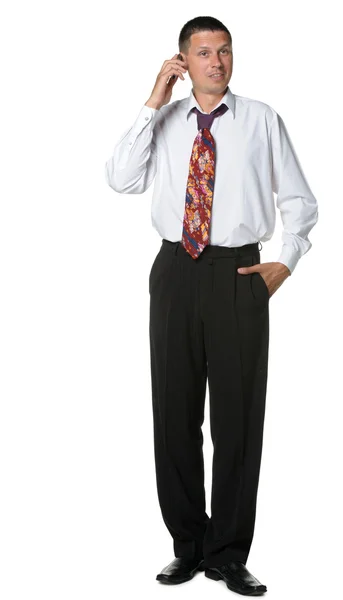 The businessman talks by a mobile phone — Stock Photo, Image