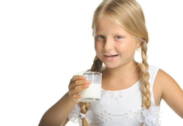 The pretty girl with a glass of milk