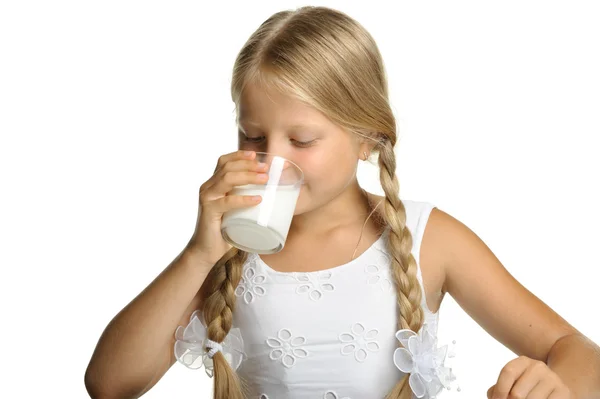 The pretty girl with a glass of milk — Stock Photo, Image