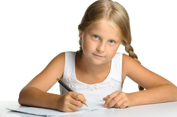 Flickan skriver till skriva-böcker. beslut av lektioner. — Stockfoto