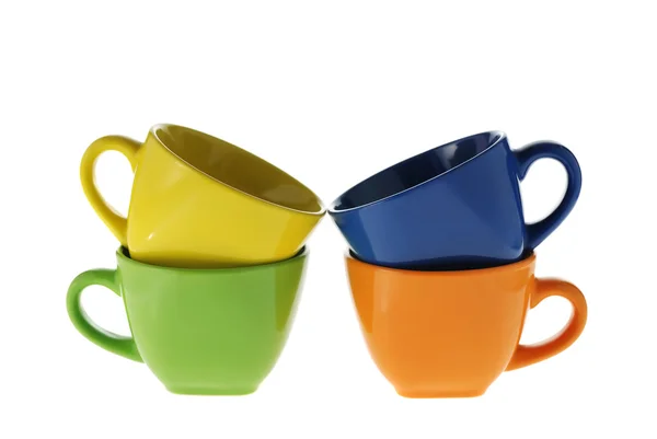 Четыре цветные чашки — стоковое фото