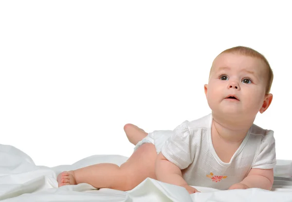 The baby on a bedsheet Royalty Free Stock Photos