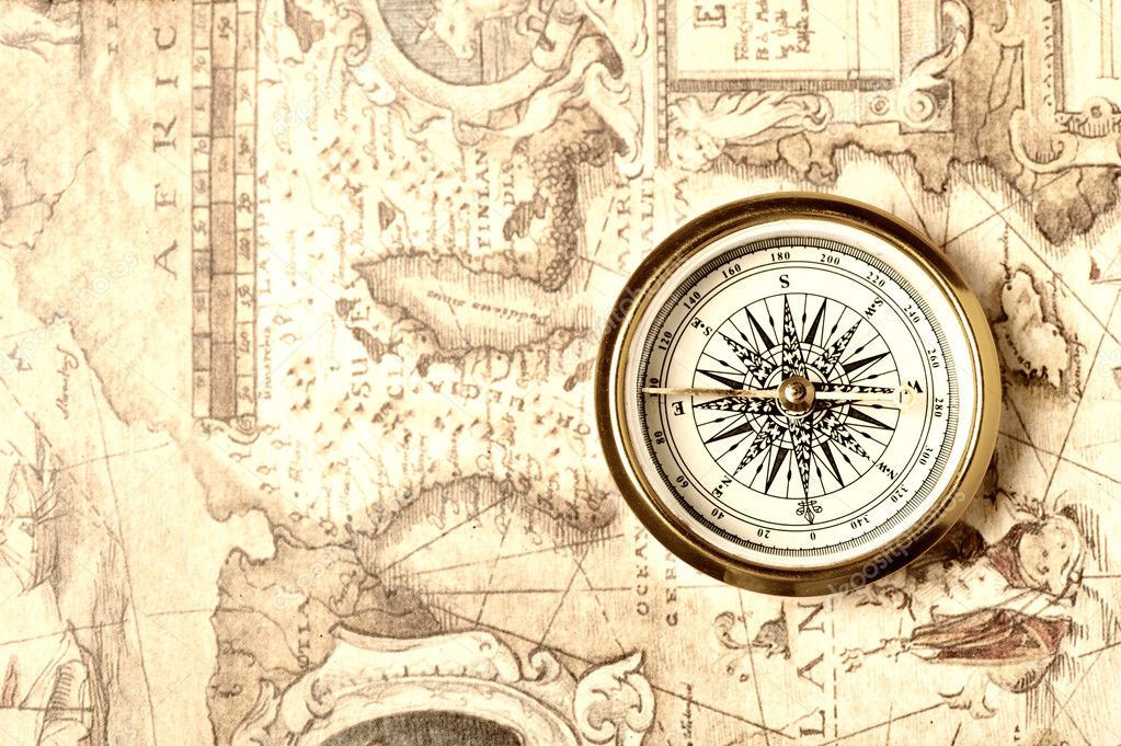 Old compass on ancient map Stock Photo by ©galdzer 5198685