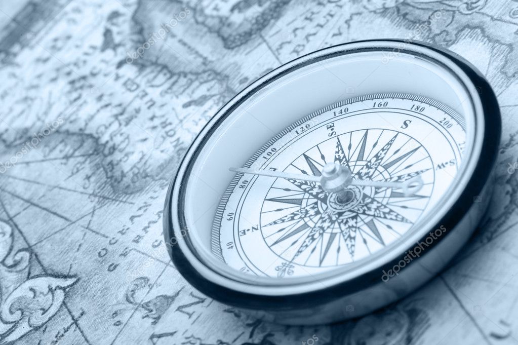 Old compass on ancient map — Stock Photo © galdzer #5198687