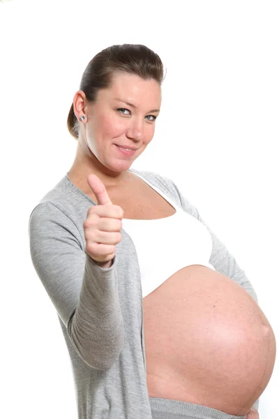 Schwangere zeigt Daumen hoch — Stockfoto