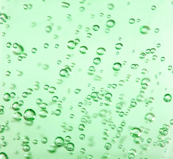 Прозорий бульбашки в зелений гель — стокове фото