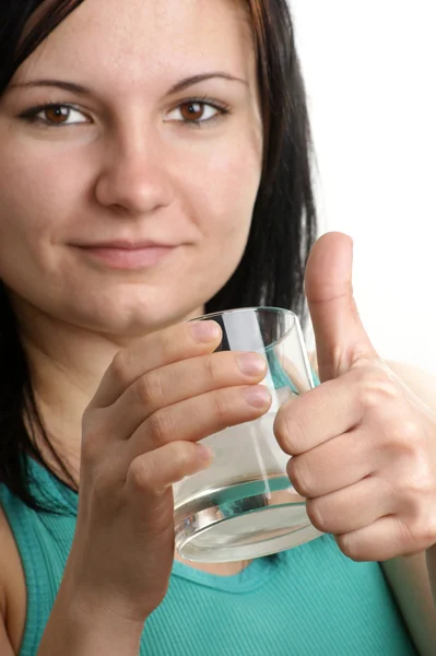 A young woman drinks some vodka with ice — Stock Photo, Image