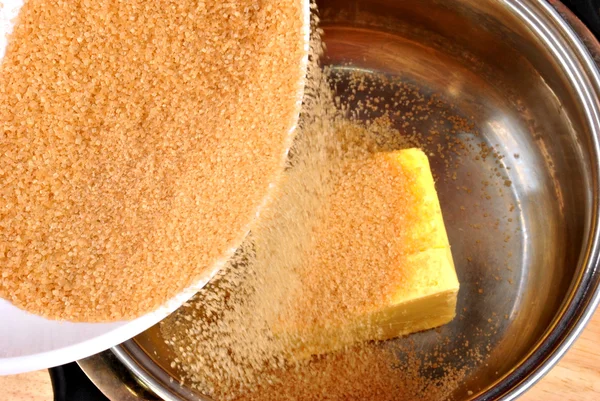 Brown sugar and some ingredients in pot — Stock Photo, Image
