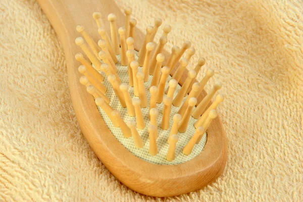 New hair brush on a terry cloth towel — Stock Photo, Image