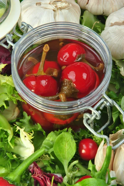 Organic red cherry paprika with vinegar in a glass — Stock Photo, Image