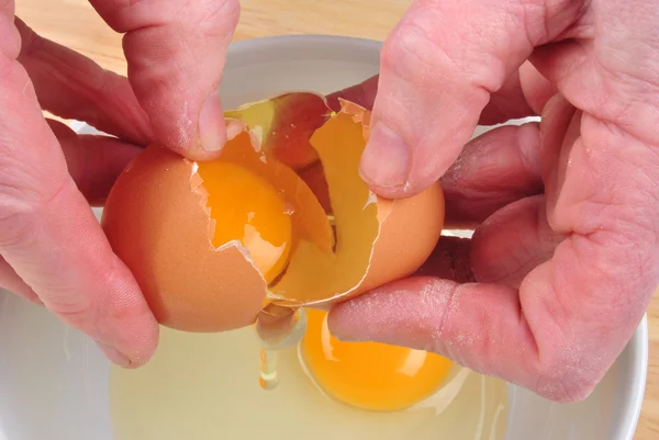 Open one organic egg to separate egg yolk — Stock Photo, Image