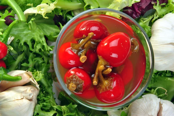 Organic red cherry paprika with vinegar in a glass — Stock Photo, Image