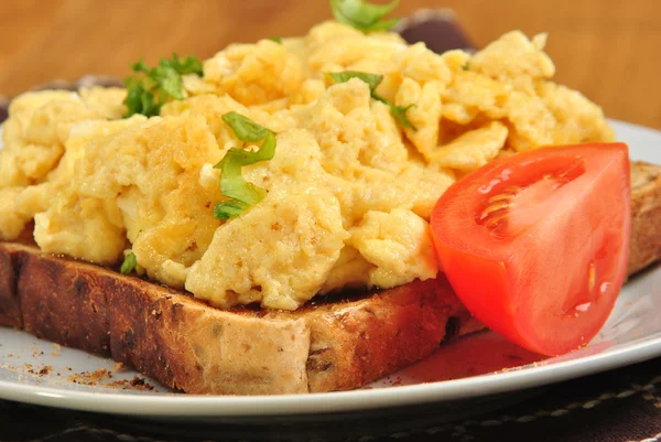 Sandwich with some organic scrambled eggs on a plate — Stock Photo, Image
