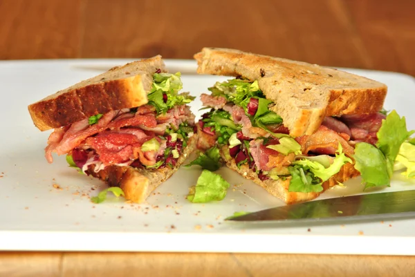 Sandwich with some organic bacon and salad — Stock Photo, Image