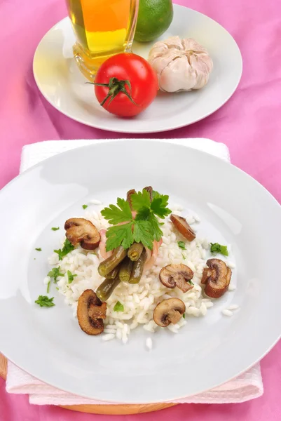 Organic risotto rice with mushroom and beans — Stock Photo, Image