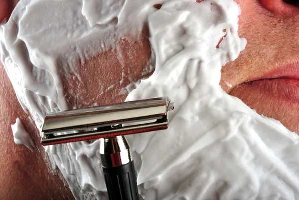 stock image One wet shaving razor and some foam in a face