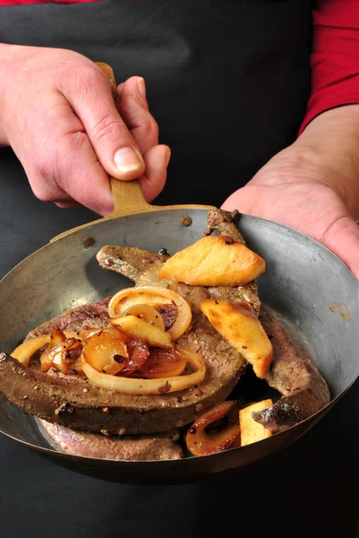 Stock image Lamb liver with apple and onion rings