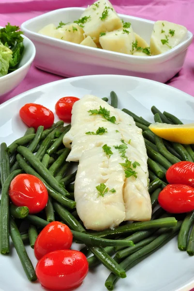 Cod loins with organic beans and tomato — Stock Photo, Image